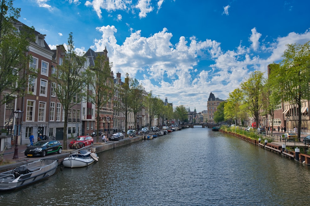 a canal with boats and buildings along it