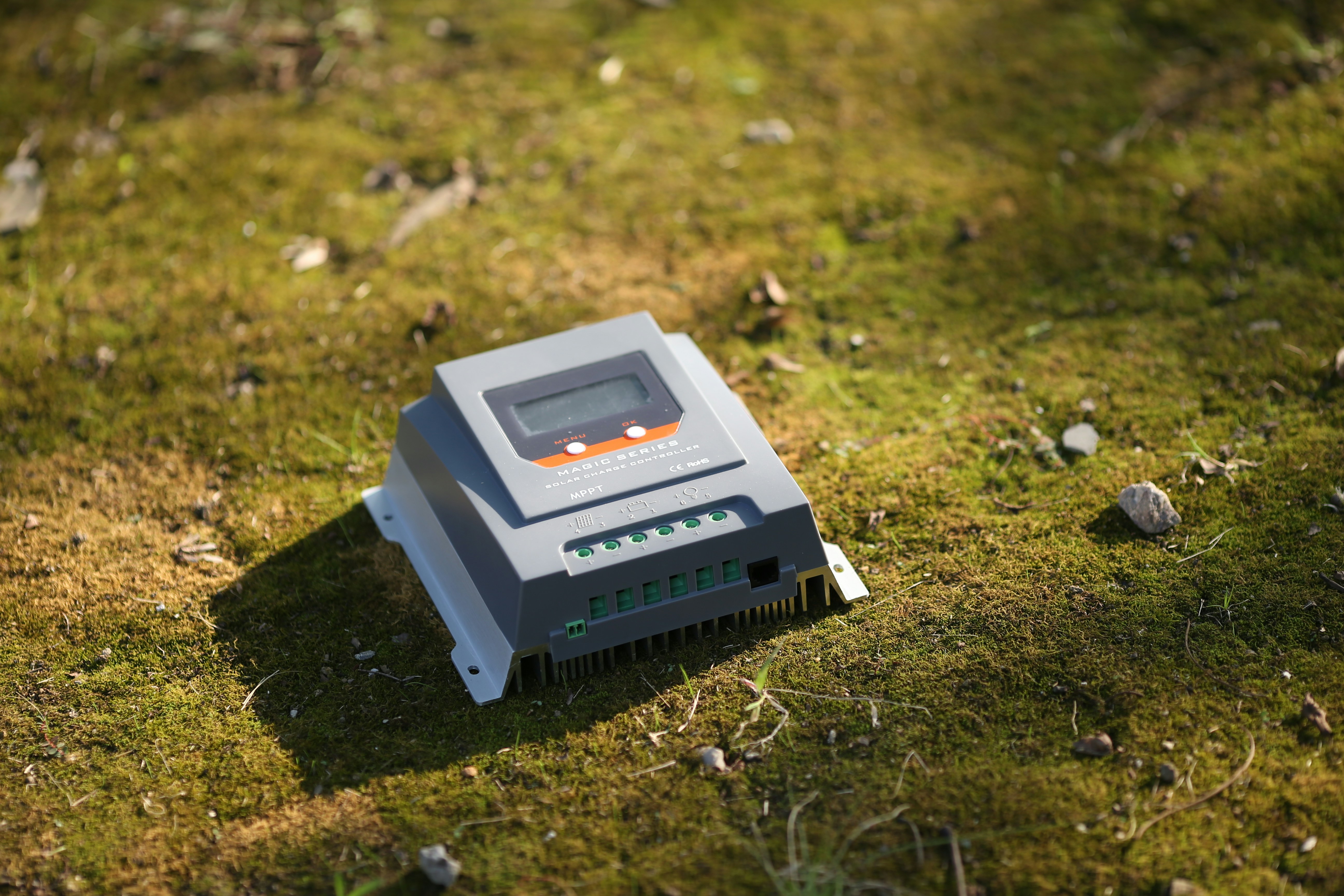 Close up of a smart garden controller with LED indicators