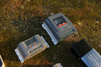 a couple of handheld game consoles