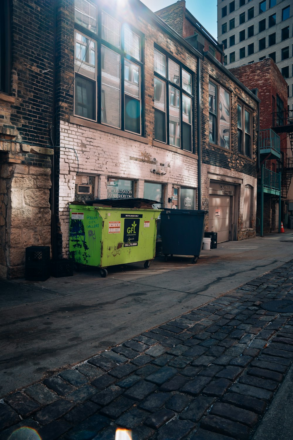 a row of trash bins