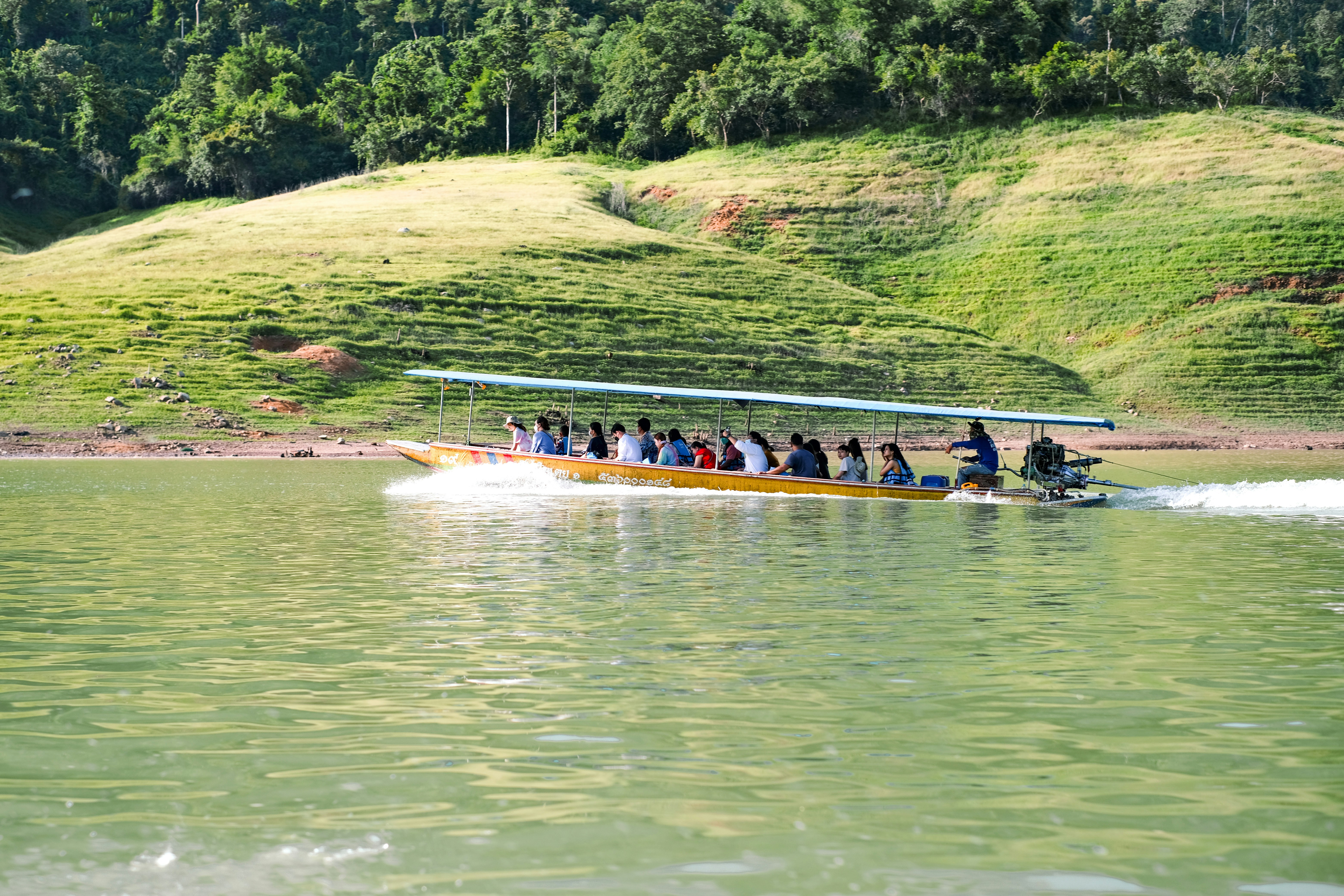 a boat full of people on a river