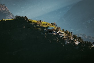 a town on a hill by the water