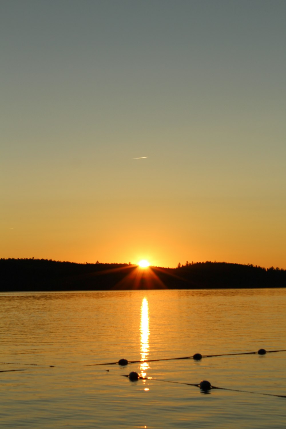 a sunset over a body of water