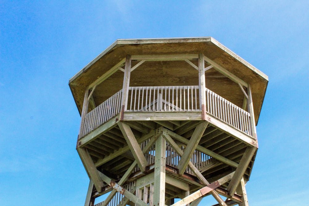 a wooden structure with a railing