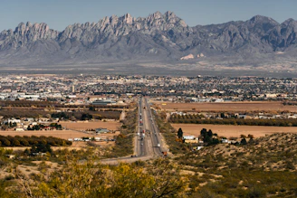 a road with a mountain in the background