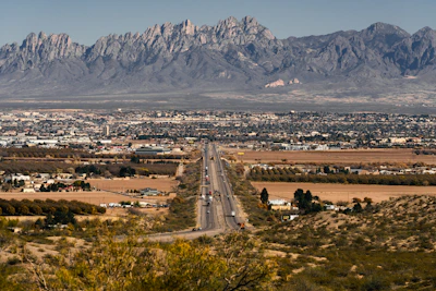 a road with a mountain in the background