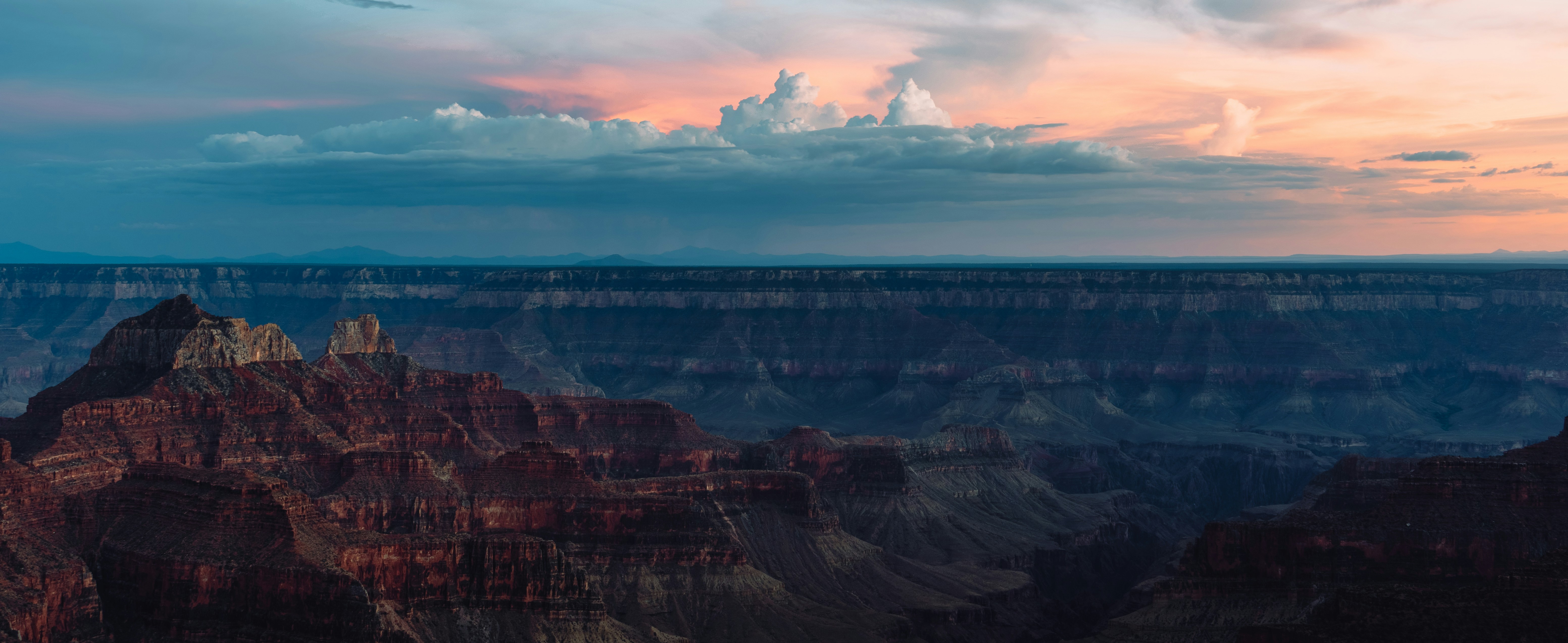 a large canyon with a river running through it