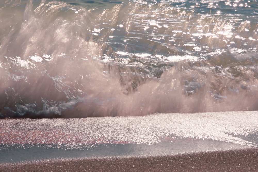 a wave crashing on a beach