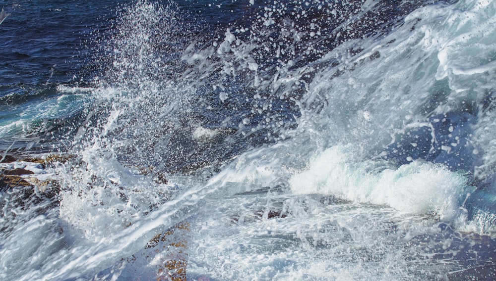 a wave crashing on a beach