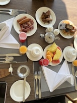 A beautifully arranged breakfast table with various dishes.