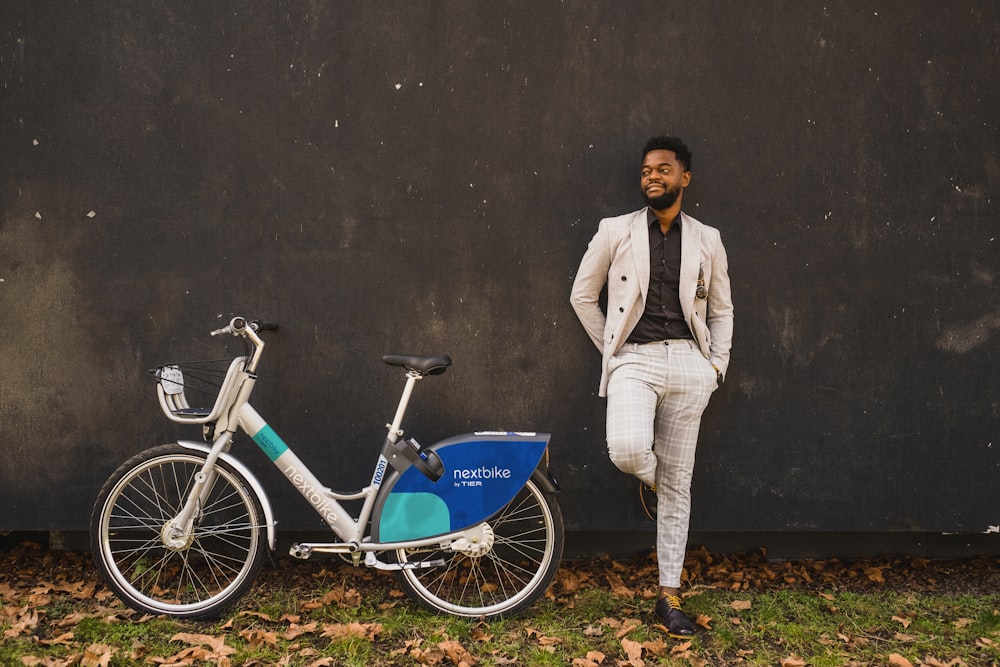 a person standing next to a bicycle