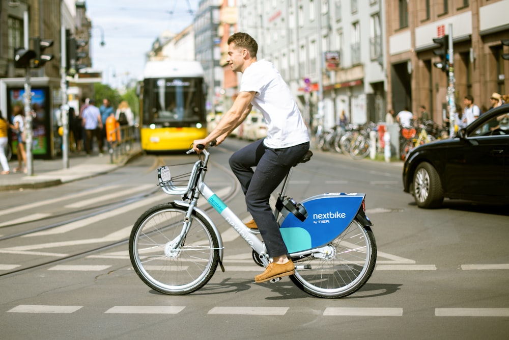 a person riding a bicycle on a street