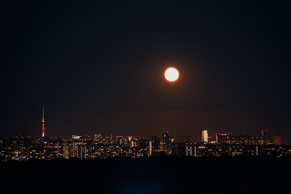 a moon over a city