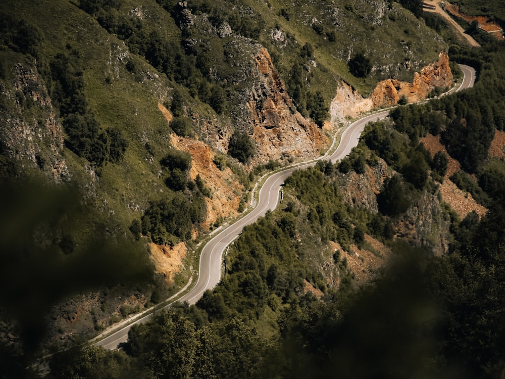 a winding road through a mountain