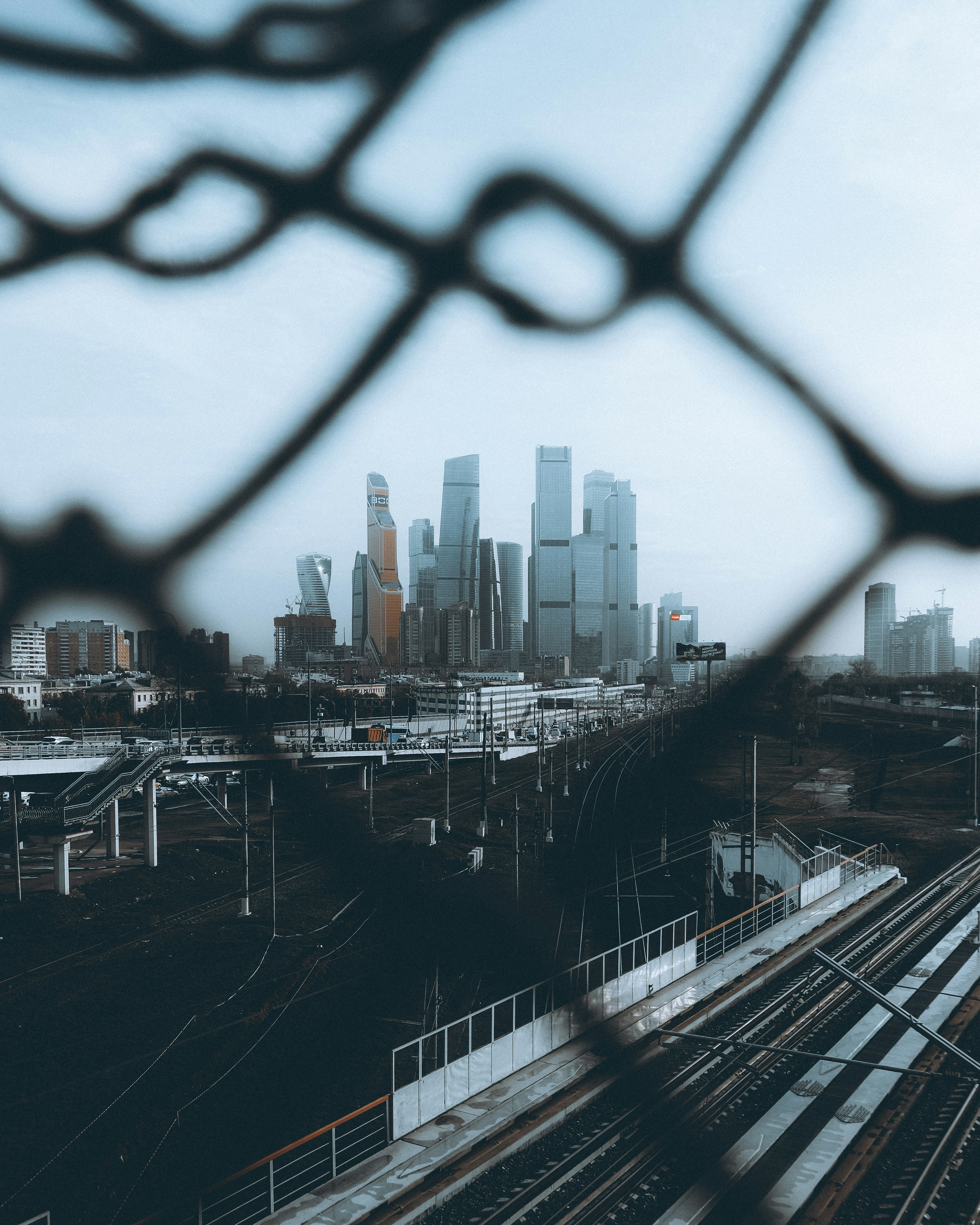 a city skyline seen through a train window