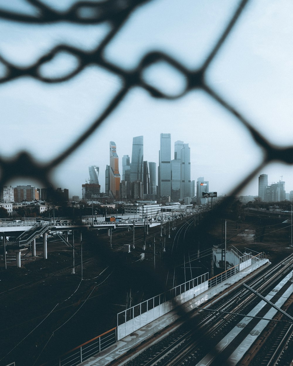 a city skyline seen through a train window