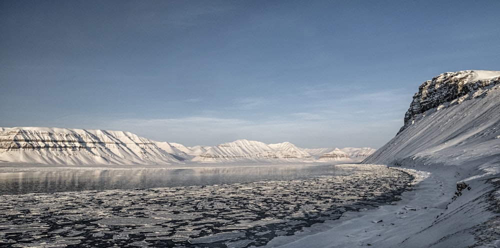 a snowy landscape with mountains