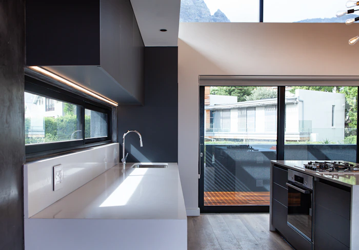 Bright kitchen with large sliding glass door letting in natural light after panel replacement