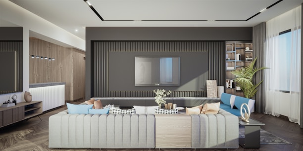 A cozy living room featuring fresh renovations with clean lines and grey accent walls.