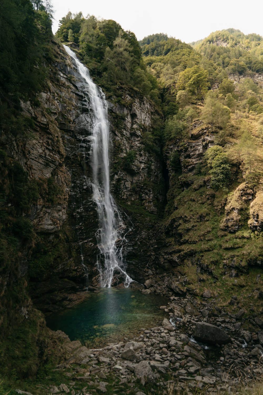 a waterfall over a rocky cliff