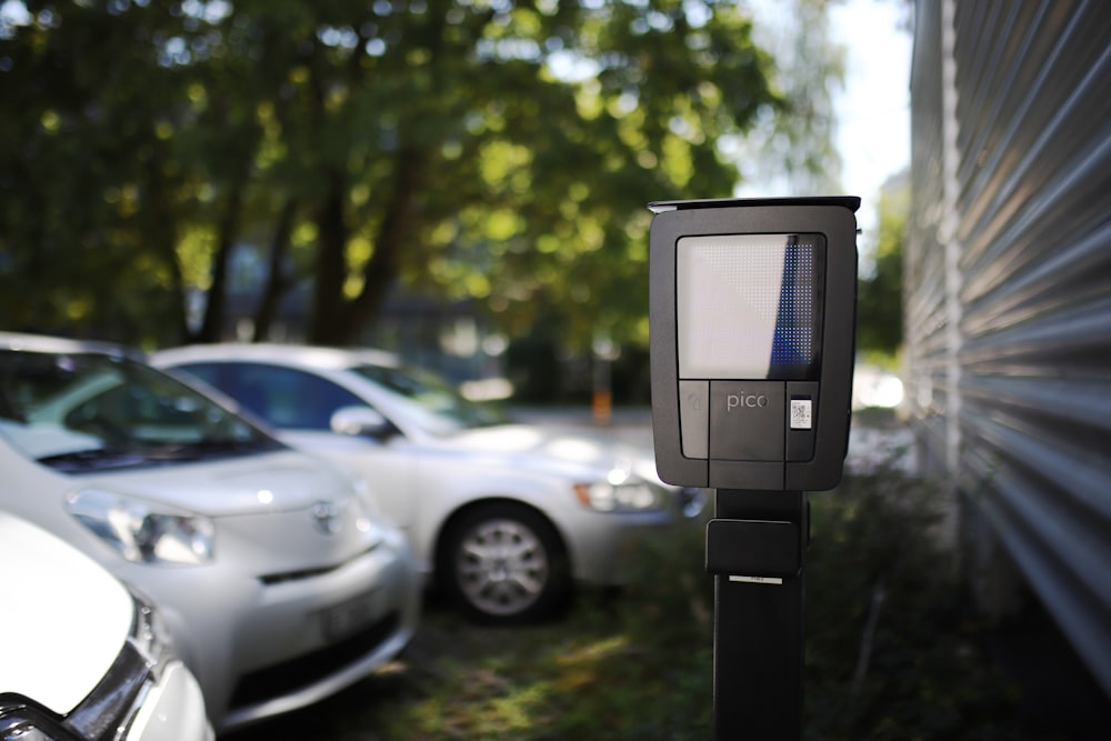 a parking meter in front of a building