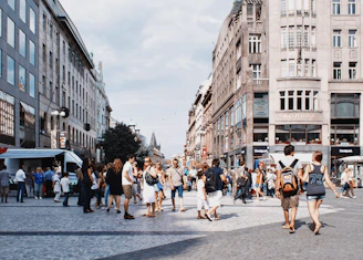 a group of people walking in a city