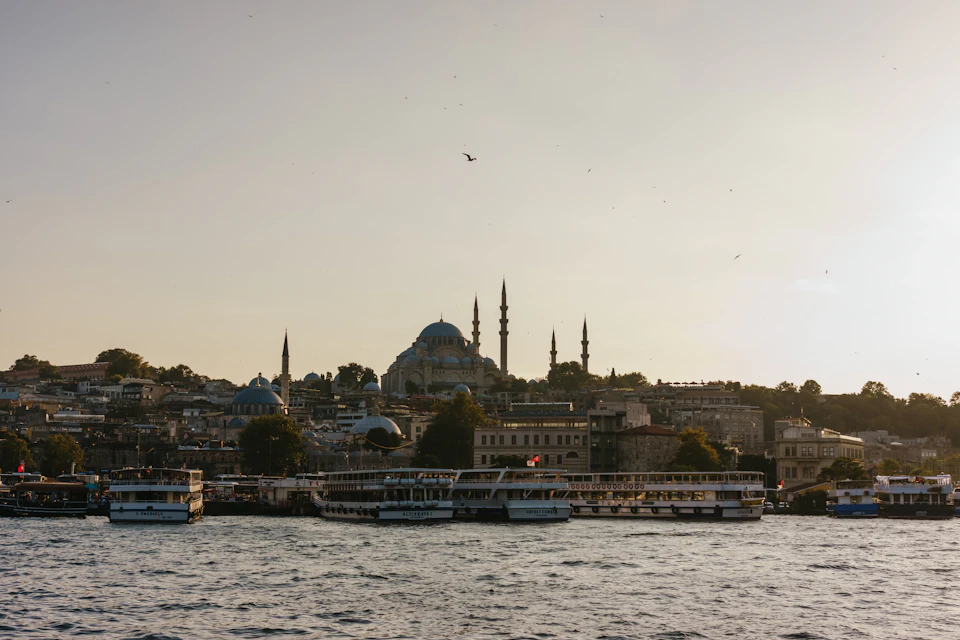 Serene Bosphorus strait scene with iconic buildings and mosque's blue dome against city skyline