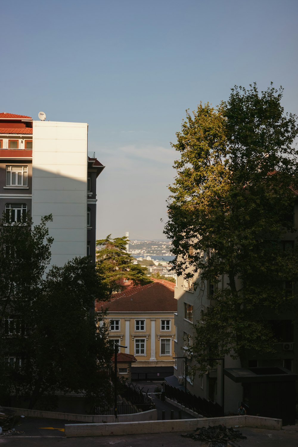 a group of buildings with trees in the front