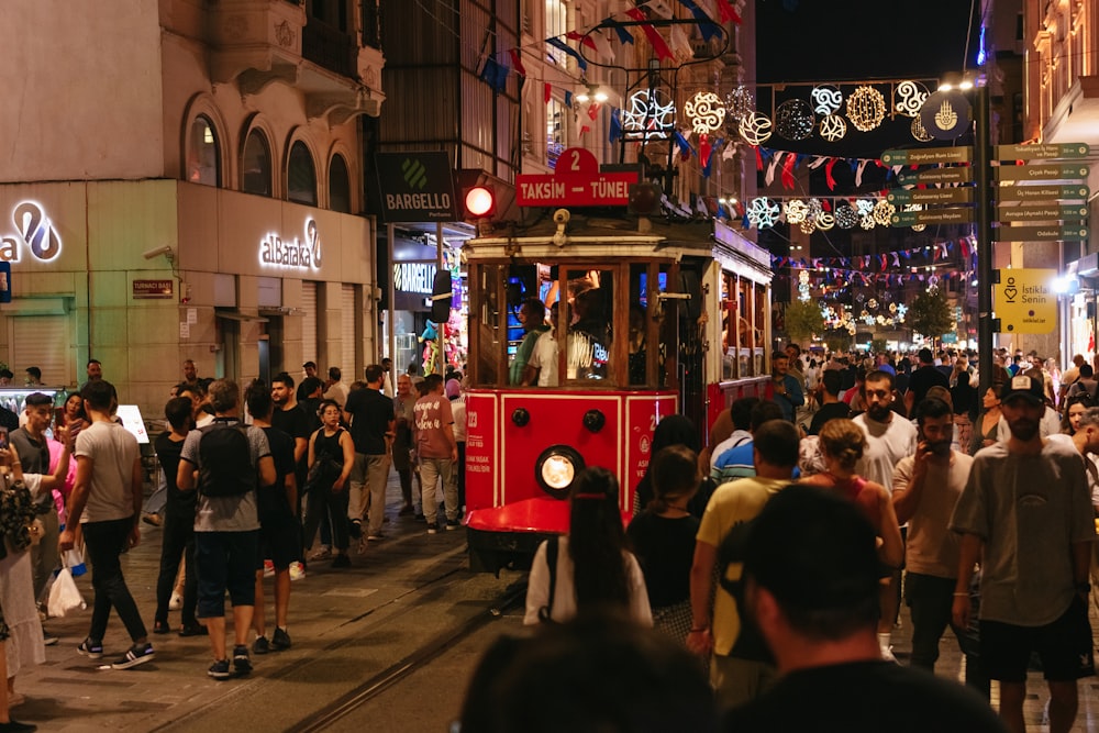 a crowd of people walking in a busy city