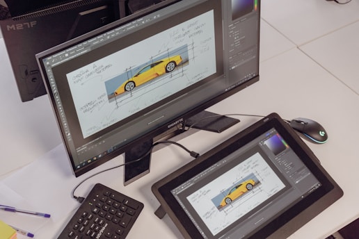 A professional drafting setup showcasing CAD software on a screen.