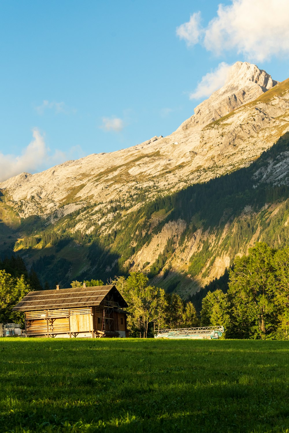 a house in front of a mountain