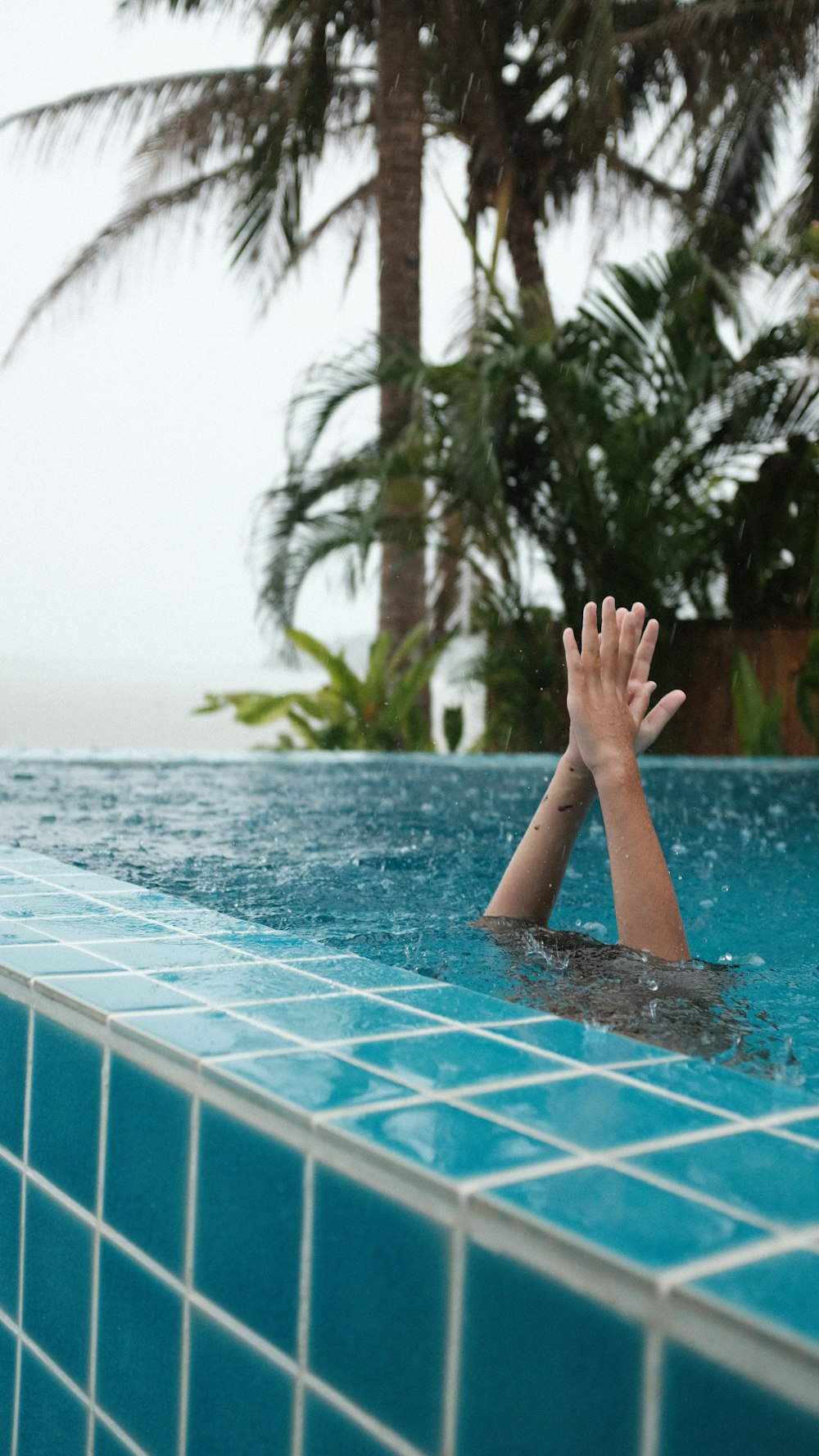 a person's feet on a pool