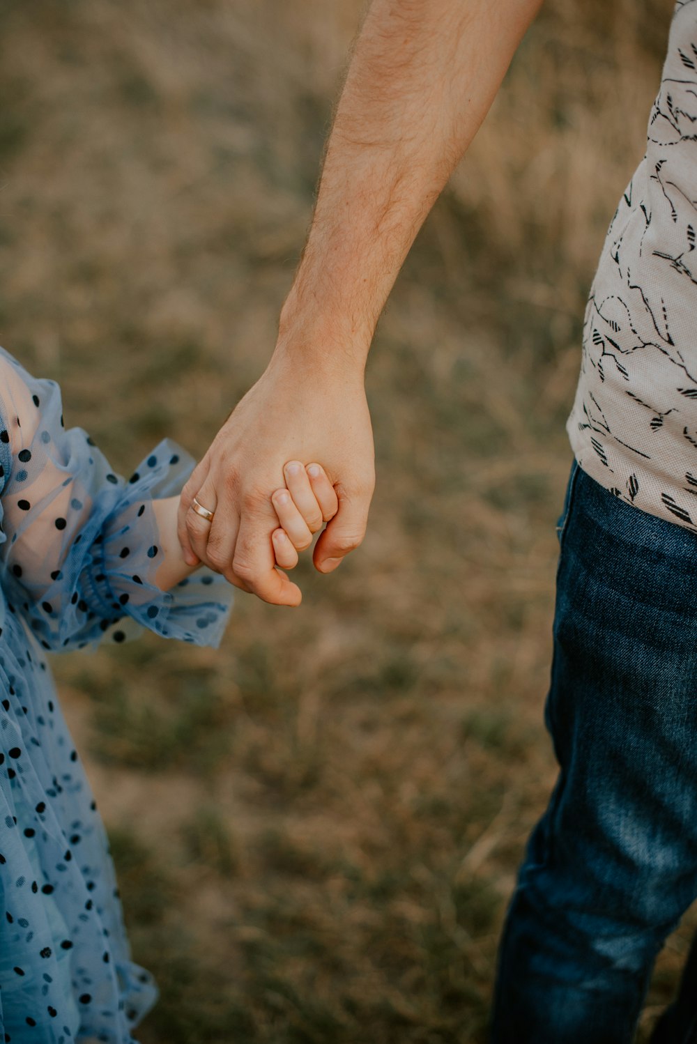 a man and woman holding hands