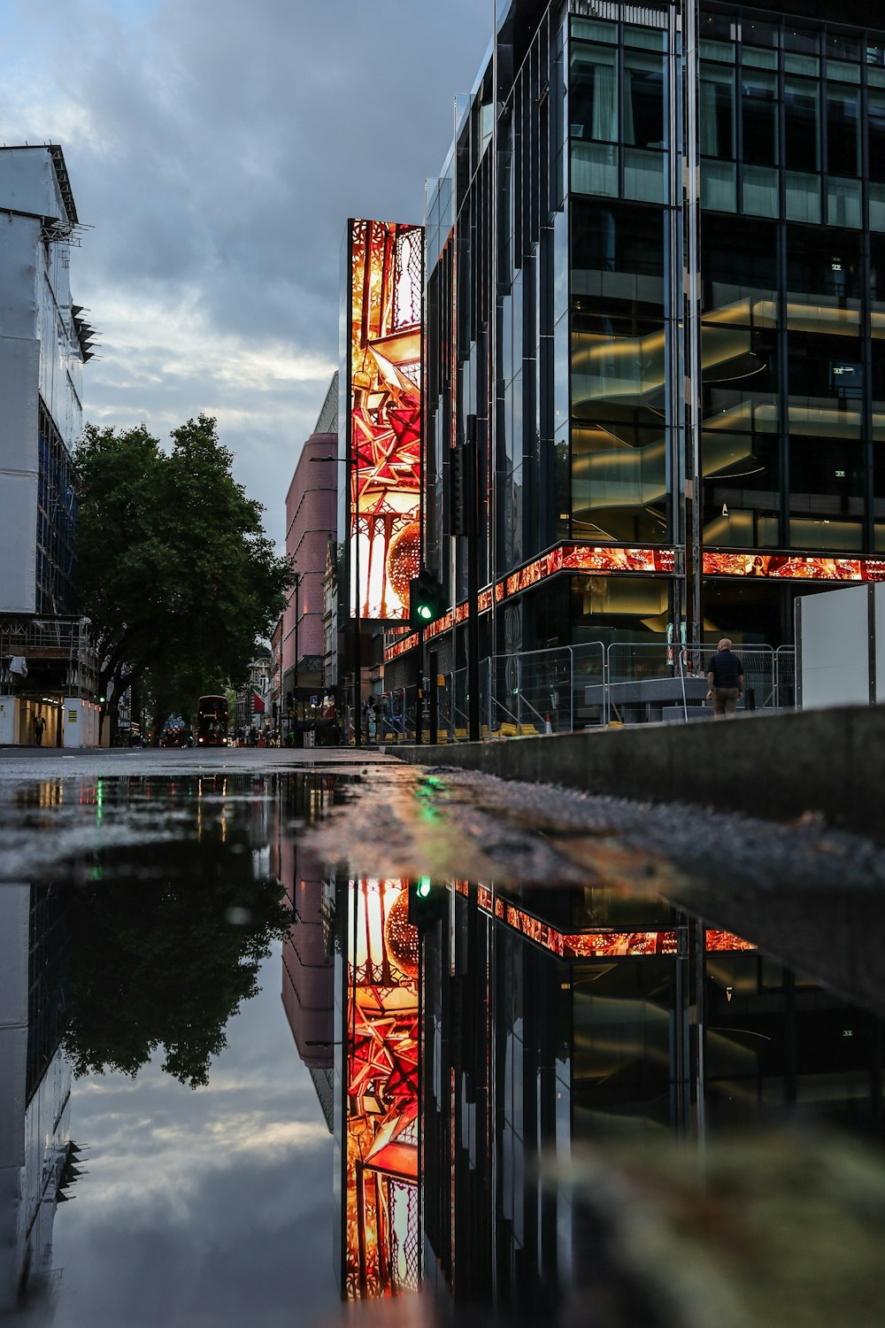 a building with a reflection of a building in the water