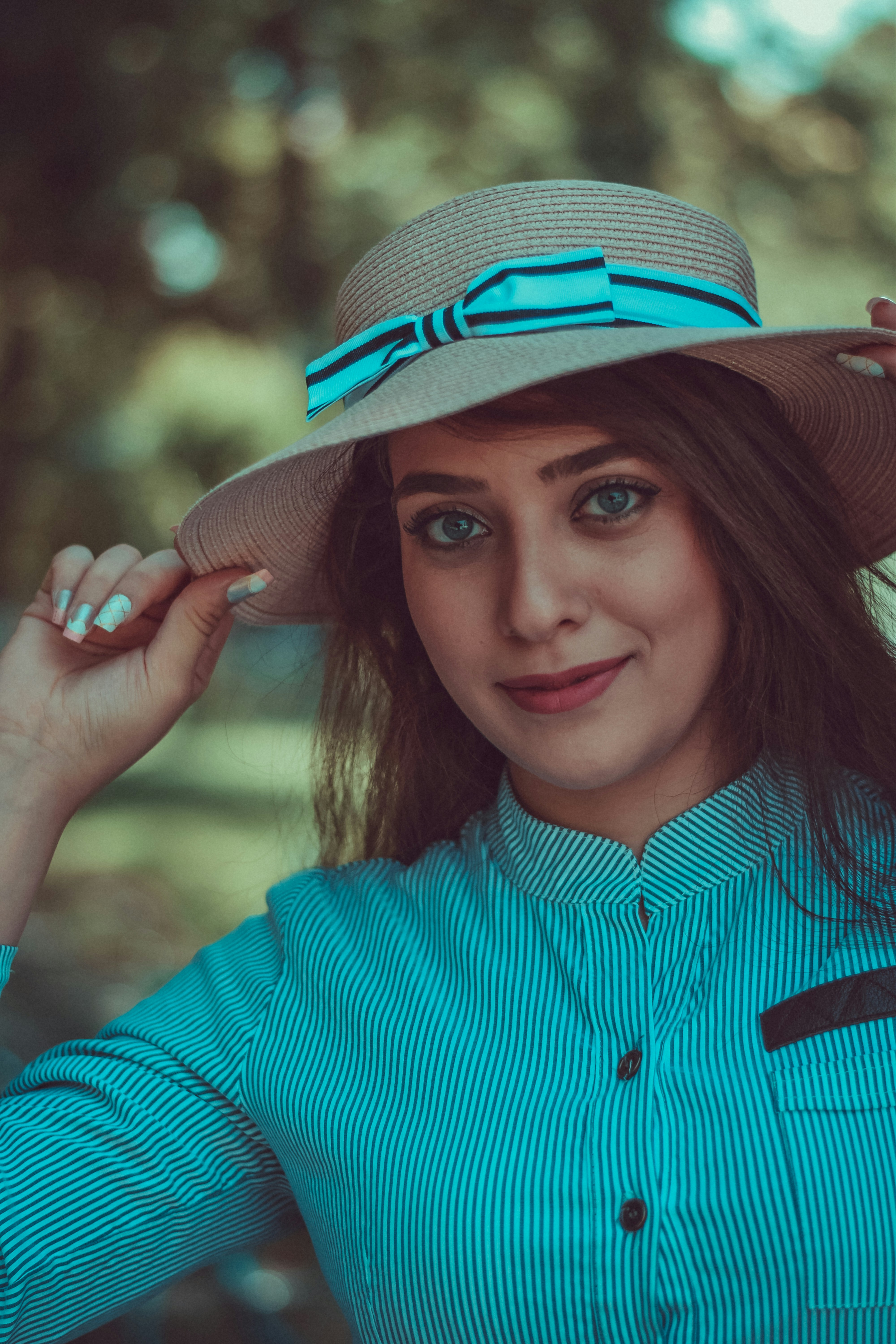 A person wearing a hat photo Free Saadabad palace tajrish Image on