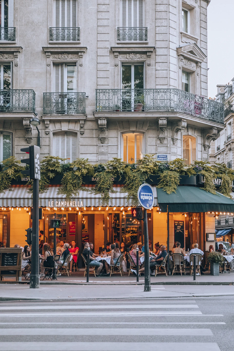 People sitting outside a Paris café