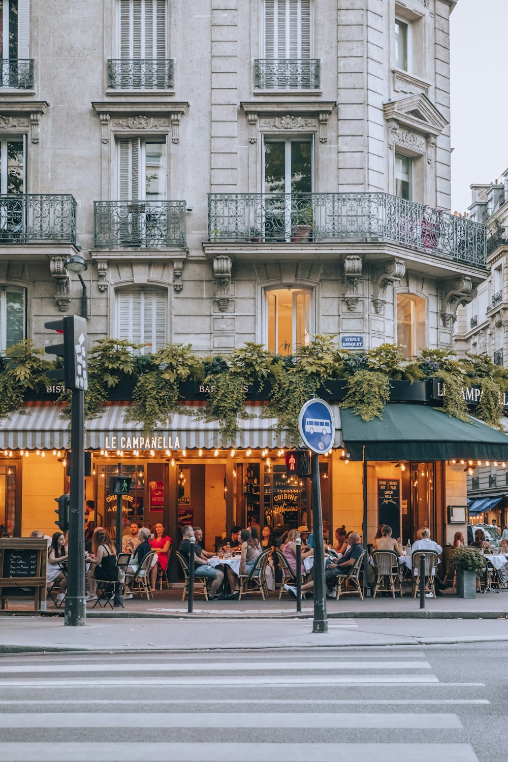 a group of people sitting outside a building