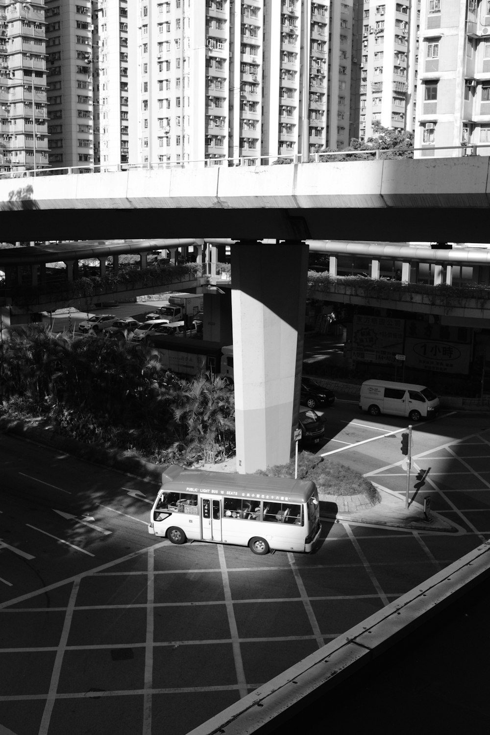 a bus driving under a bridge