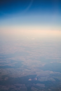 Aerial view of the makhana farm landscape blending natural green fields with clear blue skies.