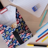 A colorful subscription box filled with various student essentials.