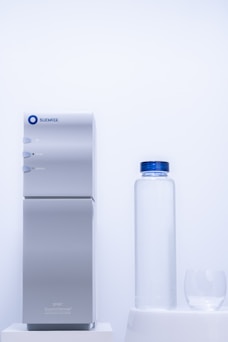 a white bottle and a white jug