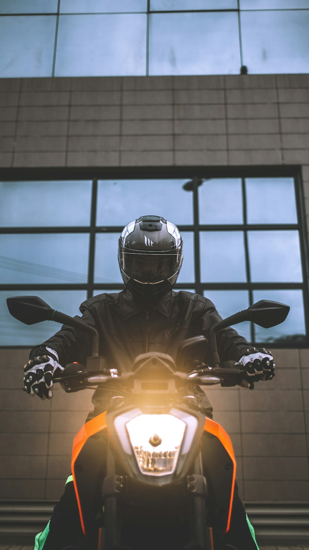 a person wearing a helmet and riding a motorcycle