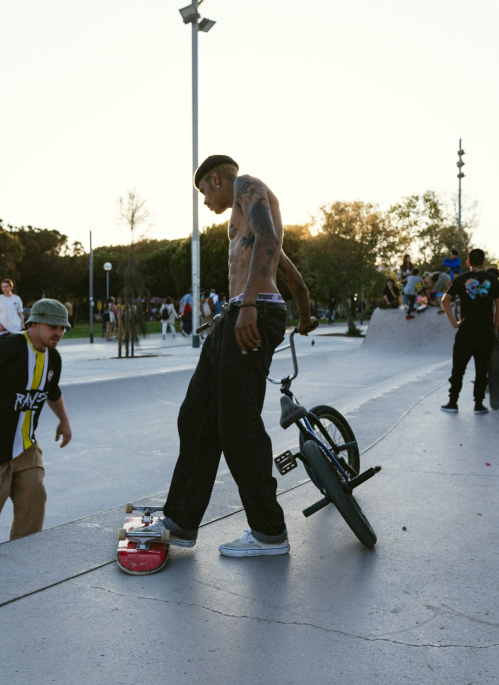 a person with no shirt on a bike