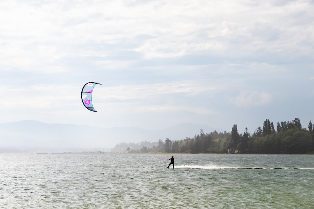 a person kite surfing on the sea