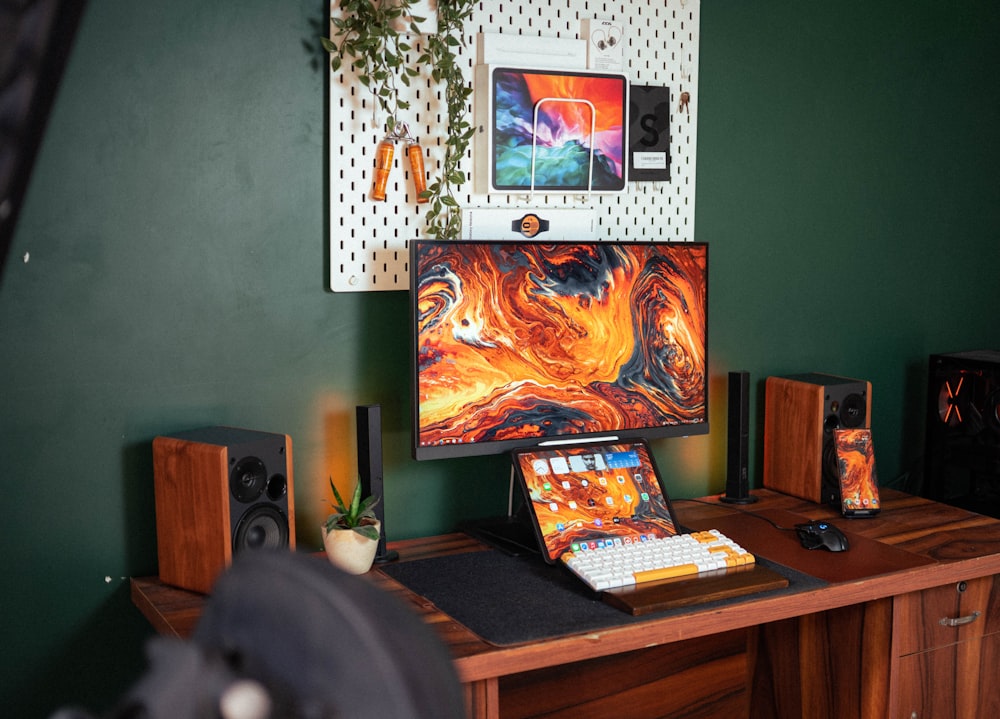 a desk with a computer and a monitor on it