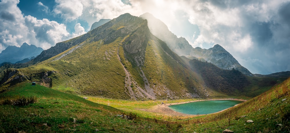 a large mountain with a lake in the middle