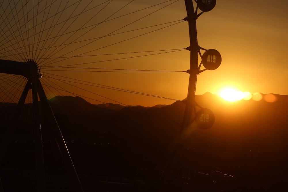 a sunset over a mountain