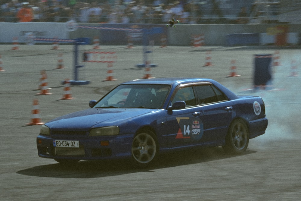 a blue car on a race track