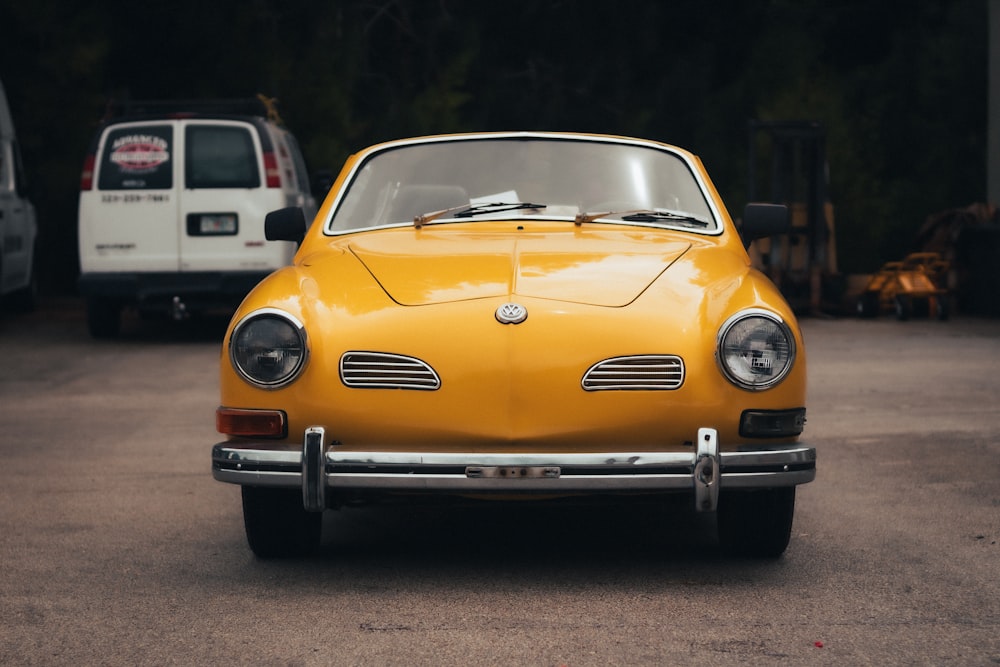 a yellow car parked on a road