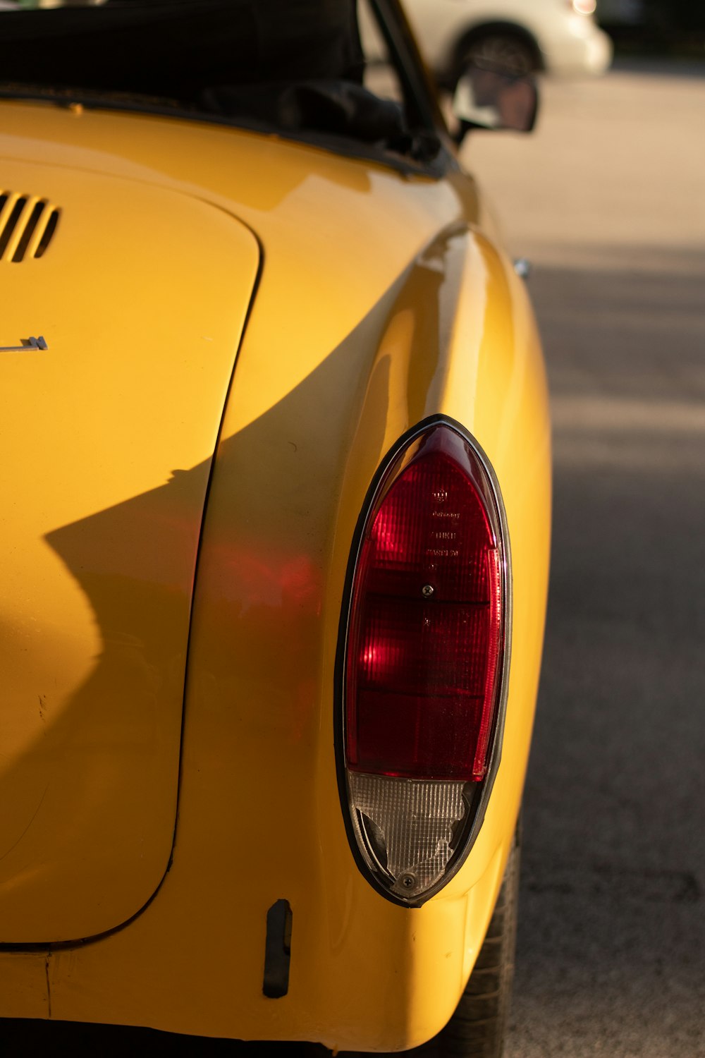 the back of a yellow car